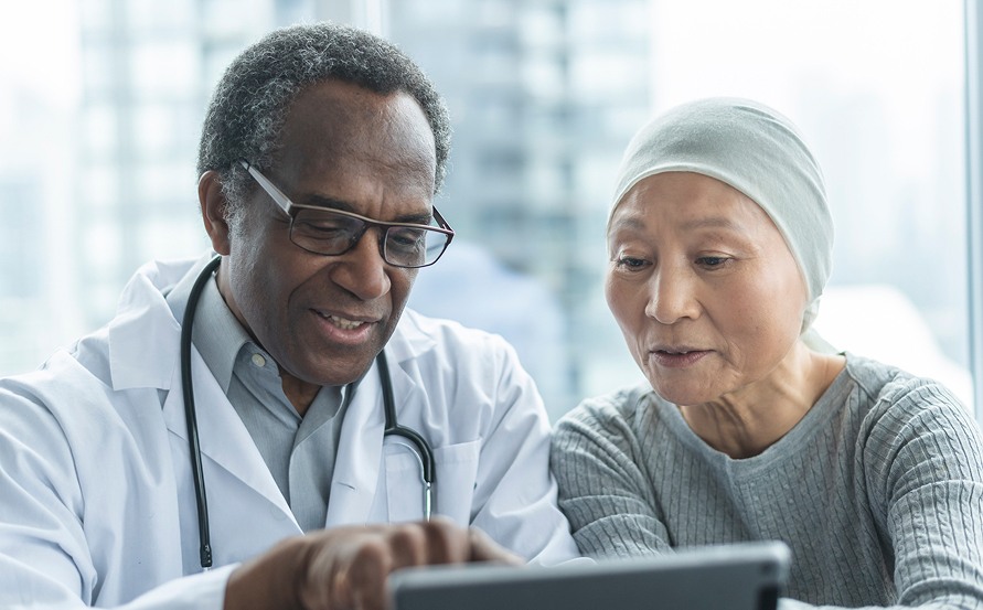 Healthcare provider meeting with a patient to discuss personalized treatment insights