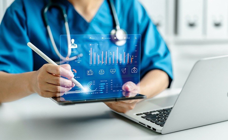 Hands holding tablet with patient summary and clinical charts displayed