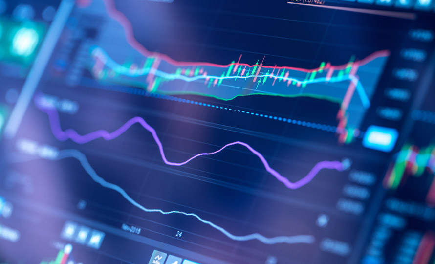 Close-up view of digital data charts and line graphs on a computer screen.
